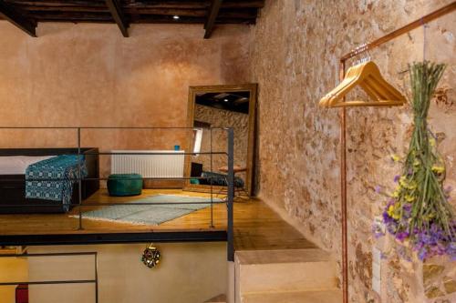 a room with a bunk bed and a staircase at History and Charm in Chania