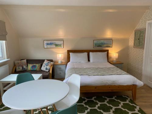 A bed or beds in a room at Willow Down 