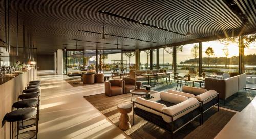 a lobby of a hotel with chairs and tables at Grand Park Hotel Rovinj by Maistra Collection in Rovinj