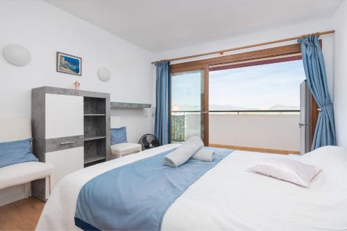 Ένα ή περισσότερα κρεβάτια σε δωμάτιο στο Apartamento Lyna