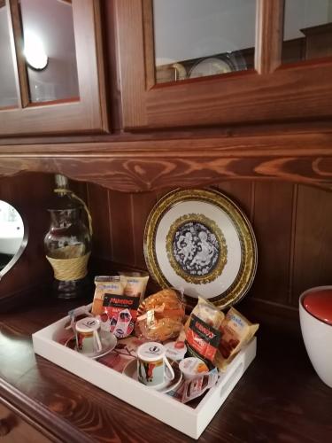 a tray of food on a counter with a plate at Antica Dimora del Drengot in Acerenza