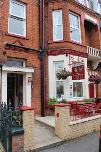 a brick building with a sign on the front of it at Grange Lodge in York