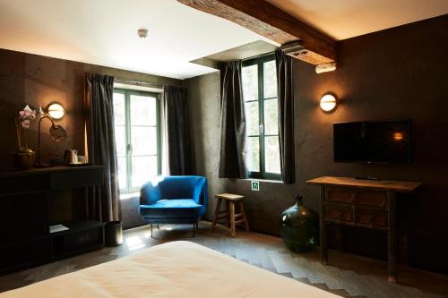 TV a/nebo společenská místnost v ubytování Nonam Boutique Hotel Gent