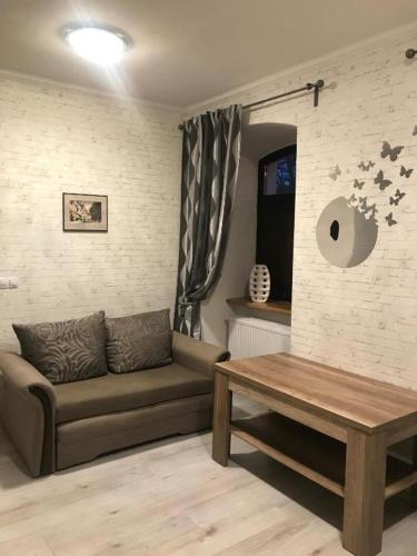 a living room with a couch and a table at Apartment Anglicka 138 in Mariánské Lázně