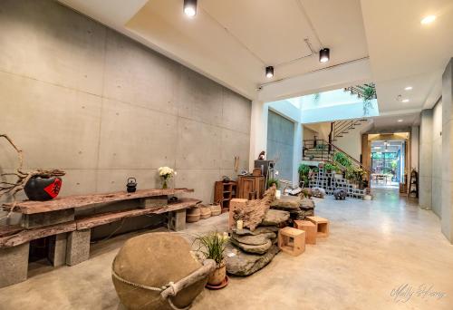 a large room with a table and chairs in it at 日月潭山慕藝旅 Sun Moon Inn in Yuchi