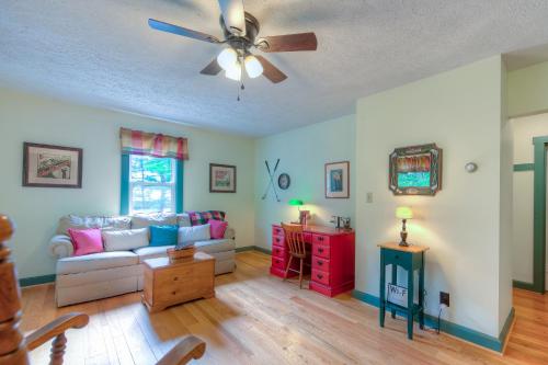 a living room with a couch and a ceiling fan at Amazing Grace in McHenry
