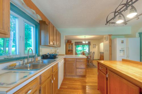 a kitchen with a sink and a refrigerator at Amazing Grace in McHenry
