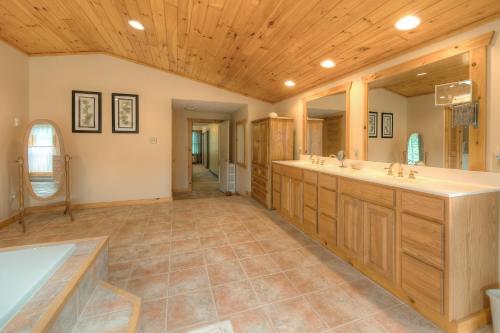 a large bathroom with two sinks and a tub at Amazing Grace in McHenry