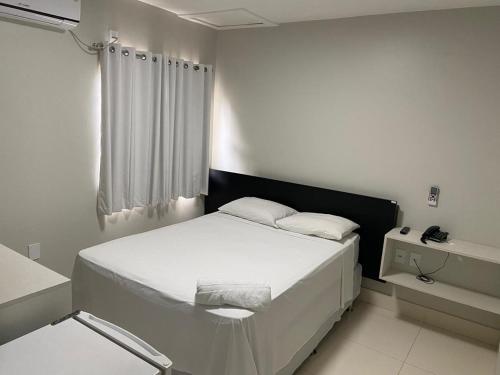 Voodi või voodid majutusasutuse Hotel Macapaba toas