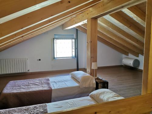 Postel nebo postele na pokoji v ubytování CASITAS PINILLA DEL VALLE