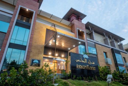 a building with a sign on the front of it at Andalus Habitat Hotel in Jeddah
