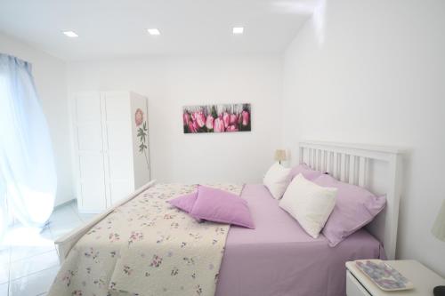 Ένα ή περισσότερα κρεβάτια σε δωμάτιο στο Blue sea apartment