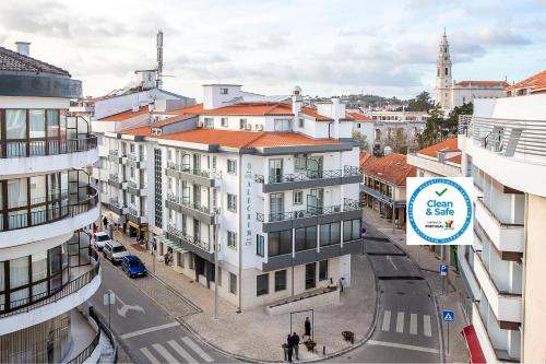 an overhead view of a city with buildings at Hotel Alecrim in Fátima