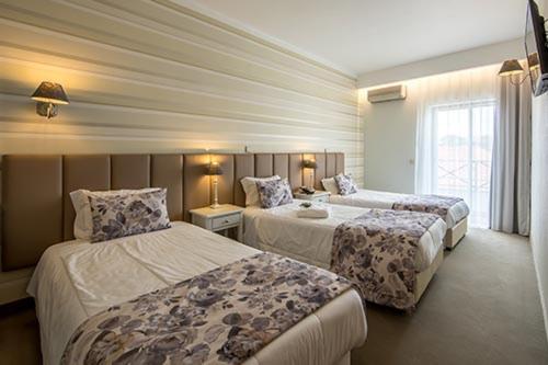 Postel nebo postele na pokoji v ubytování Hotel Alecrim