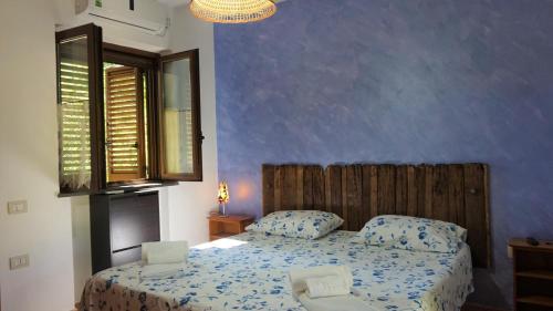 Postel nebo postele na pokoji v ubytování B&B Donna Maja