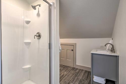 a bathroom with a shower and a sink at Peaceful Schulenburg Farmhouse with Fire Pit and Grill in Schulenburg