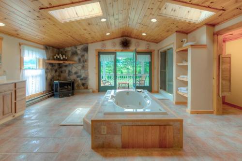 a large bathroom with a tub in the middle of the room at Amazing Grace in McHenry