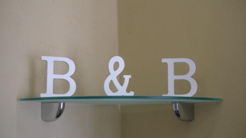 a shelf with a sign that says bar and b at Royal Dante in Naples