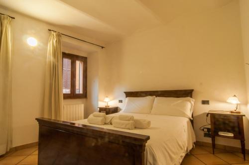 Ένα ή περισσότερα κρεβάτια σε δωμάτιο στο Umbrian Concierge - Alla Rocca