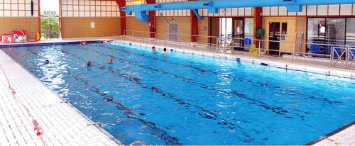 a large swimming pool with people in the water at Skegness Holidays at Haven in Skegness