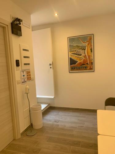 a room with a picture of a woman on the wall at Affittacamere Vallesanta in Levanto