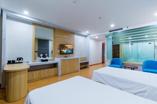 Un ou plusieurs lits dans un hébergement de l'établissement SAKURA HOTEL
