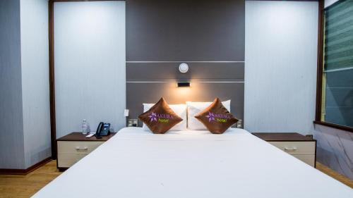 Un ou plusieurs lits dans un hébergement de l'établissement SAKURA HOTEL