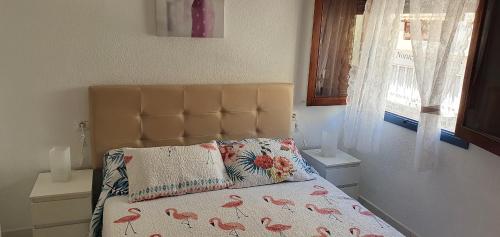 Ένα ή περισσότερα κρεβάτια σε δωμάτιο στο Fabulous 2-bedroom apartment right on the beach of Los Crstianos