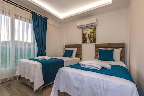 Katil atau katil-katil dalam bilik di Bella- 4 Bedroom Holiday Villa in Oludeniz