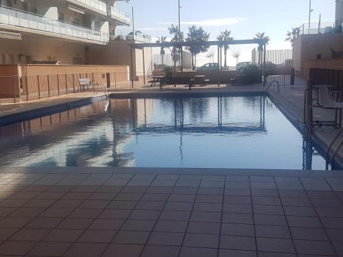 a swimming pool in the middle of a building at Apartamento Bea Beach in Badalona
