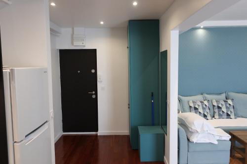 a room with a bed and a black door at Central 2 in Craiova
