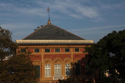 a large brick building with a cross on top of it at Grand Hotel Villa Balbi in Sestri Levante