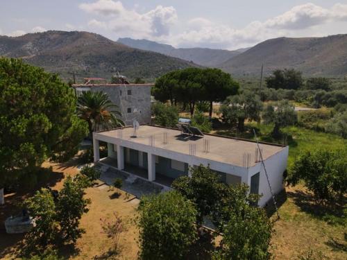 an aerial view of a house in a field at Pension Lakis in Prinos