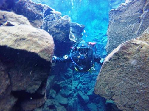 a person in a diving suit in the water at 103 ELEGANT 2 bed apartment with free Wifi, AC, pool & gym! in Larnaka