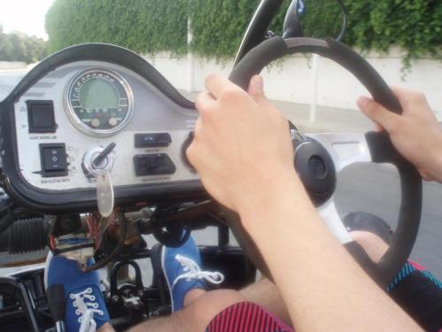 a person driving a motorcycle with their hands on a steering wheel at 103 ELEGANT 2 bed apartment with free Wifi, AC, pool & gym! in Larnaka