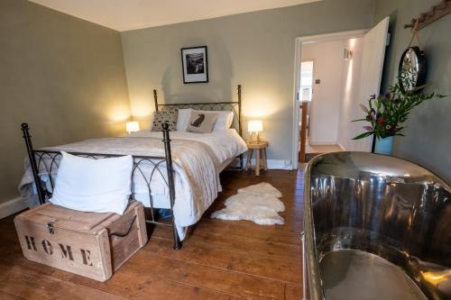 Ένα ή περισσότερα κρεβάτια σε δωμάτιο στο Sett Cottage