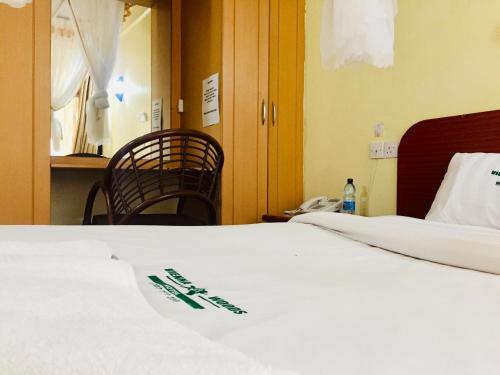 Кровать или кровати в номере Vienna Woods Hotel Nakuru