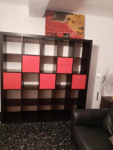 a dresser with red and pink squares on it at nirvana in Genoa