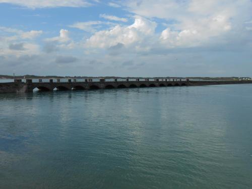 a bridge over a large body of water at Maison centre bourg Port-Bail in Portbail