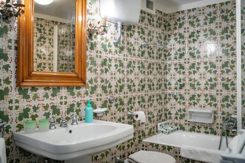 a bathroom with a sink and a mirror at Charming Villa in Capri