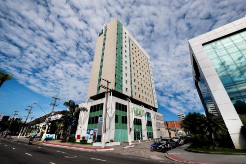 a tall building on the side of a street at ibis budget Vitoria in Vitória