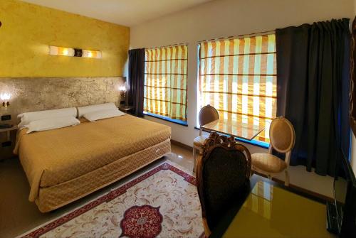 Una cama o camas en una habitación de Hotel Feel Inn Venice Airport