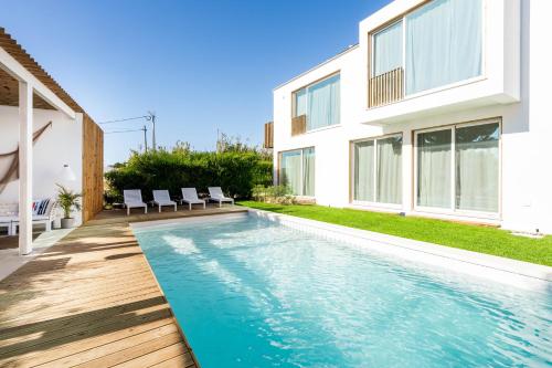 a swimming pool in the backyard of a house at Casa Vica - Sagres Apartments in Sagres