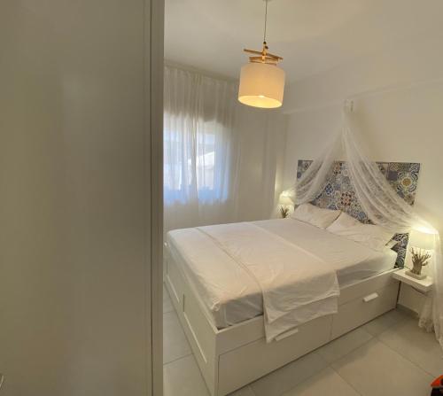 Casa Aletos Roccalumera-Taormina 객실 침대