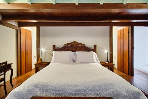 Cama ou camas em um quarto em A Casa de Paulo Autran