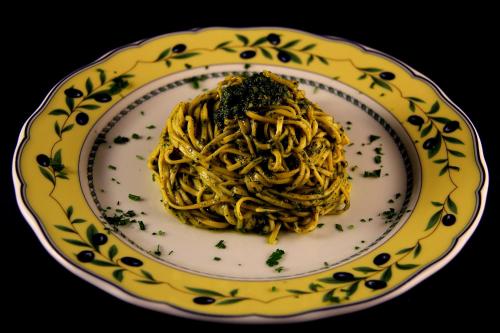 a plate of pasta on a table at La Favorita Apricale B&B & Ristorante in Apricale