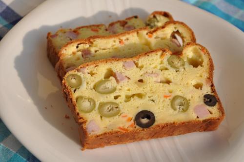 a white plate with a slice of bread with olives at Villa Bellavista Alba, B&B in Alba