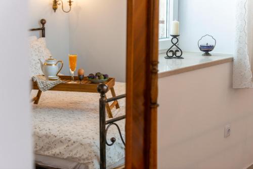 aoyer with a table with a tray of fruit on it at Apartment Old Garden Dubrovnik in Dubrovnik