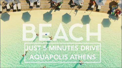 a poster for a resort with people in a swimming pool at Nesto Athens Airport in Spáta