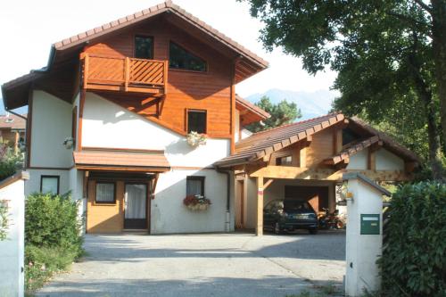 a house with a balcony on the side of it at Studio "Le Plan du Crêt" in Mercury